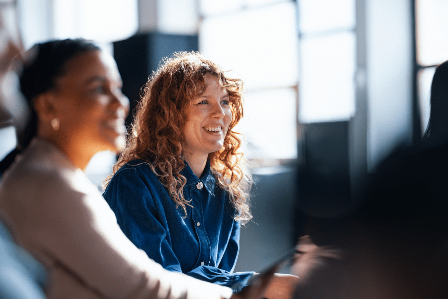 Two women at an office meeting