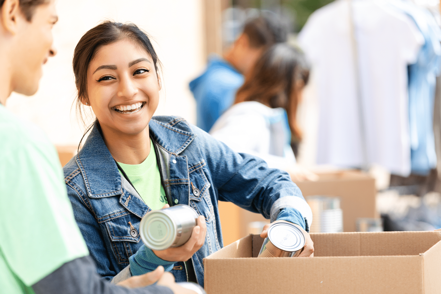 Young woman helping at food drive