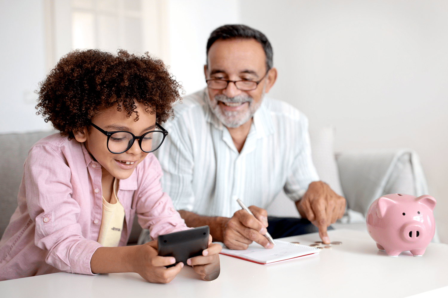 Father showing kid about saving money